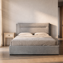 Cama canapé abatible OLMO tapizada en gris, en un dormitorio